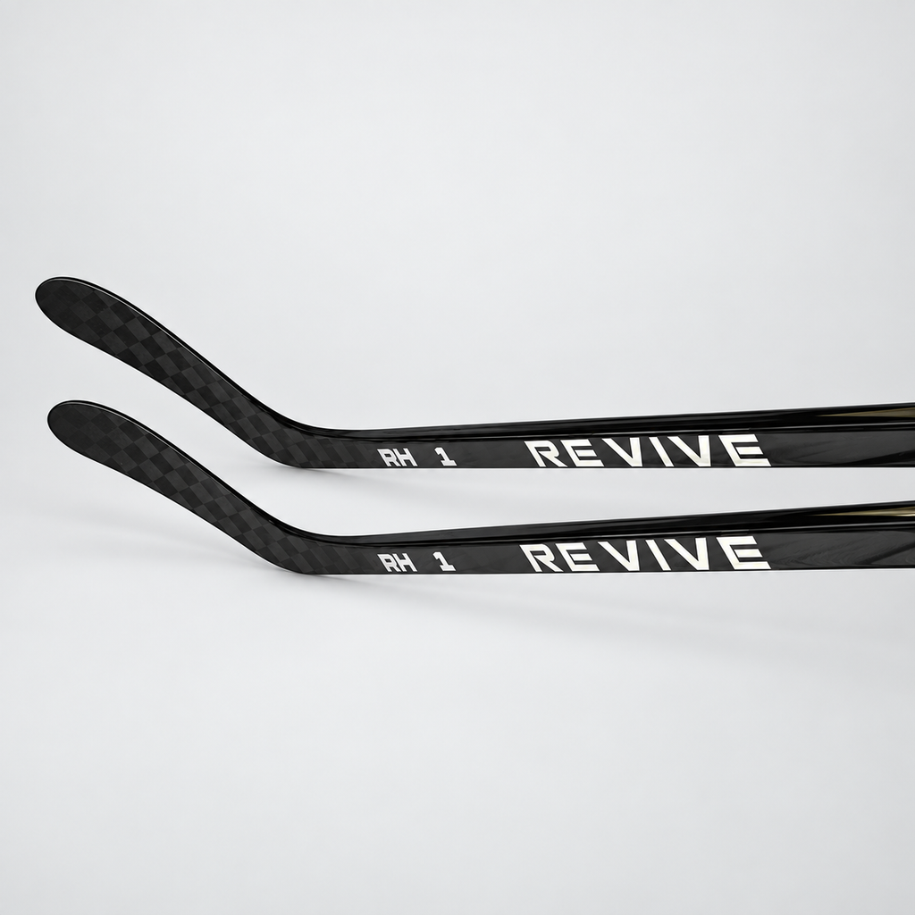 Two Revive RH1 Senior hockey sticks showing carbon construction and branding